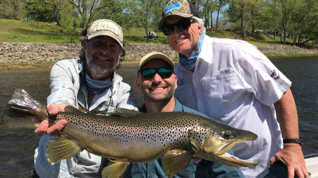 three men one big fish